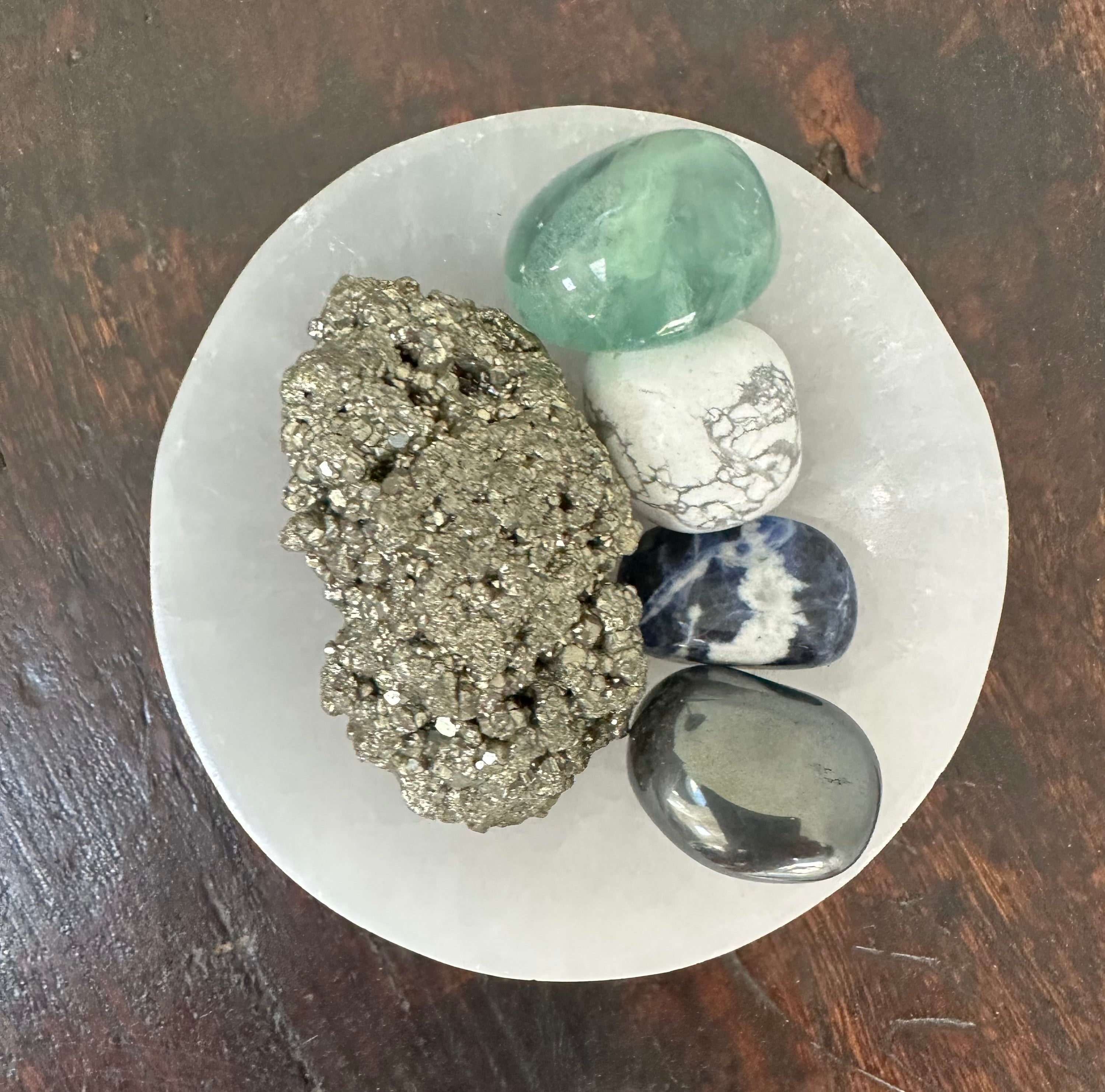 5 Crystal pack in selenite charging dish - raw pyrite, green fluorite, hematite, sodalite, and white howlite.