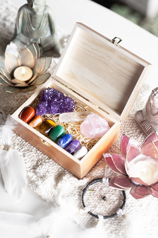 Chakra balancing crystal set with 10 healing stones - raw amethyst cluster, rose quartz, clear quartz point, red jasper, carnelian, tigers eye, green aventurine, sodalite, amethyst and white howlite in an engraved wooden keepsake box.