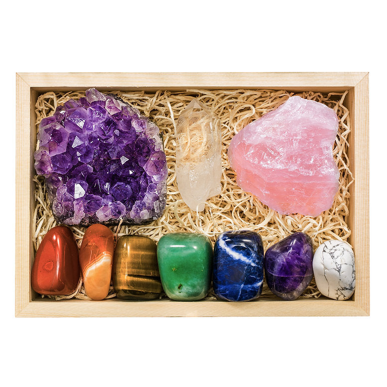 Chakra balancing crystal set with 10 healing stones - raw amethyst cluster, raw rose quartz, clear quartz point, red jasper, carnelian, tigers eye, green aventurine, sodalite, amethyst and white howlite in an engraved wooden keepsake box.
